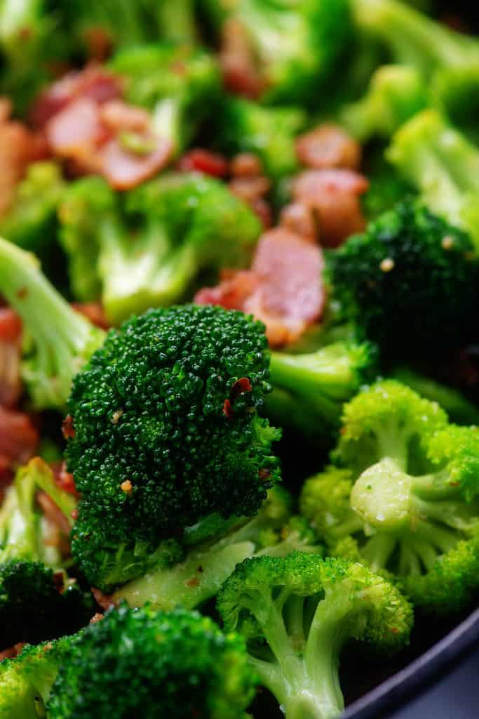 bacon and broccoli in cast iron skillet.