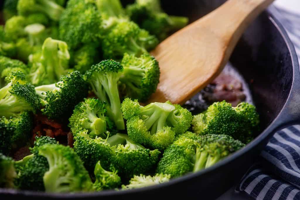 broccoli and bacon in cast iron skillet.