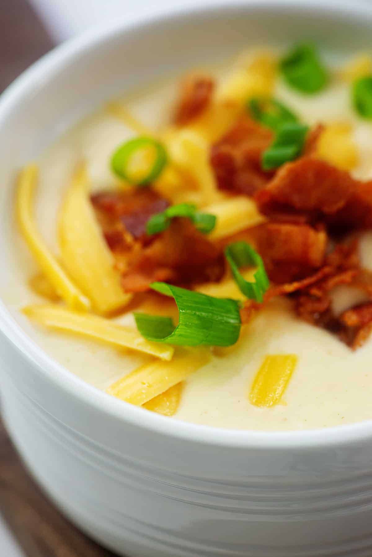 loaded cauliflower soup topped with cheddar and bacon