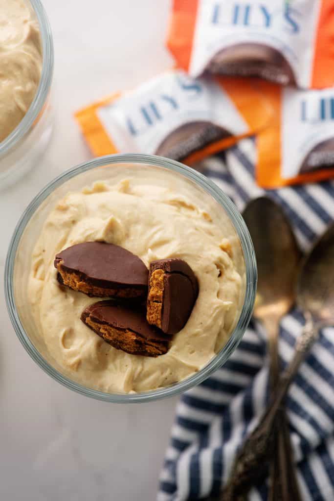low carb mousse in glass dish with peanut butter cups on top.