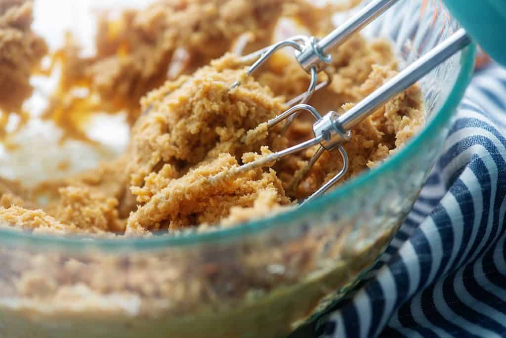 peanut butter mixture in glass mixing bowl.