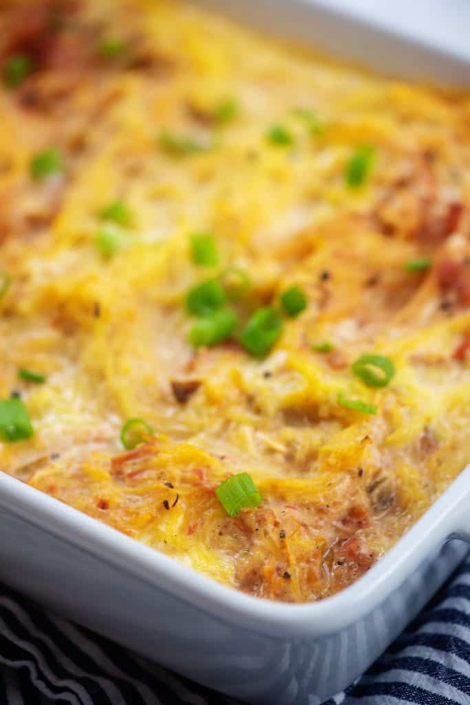 baked chicken spaghetti squash casserole in white dish.