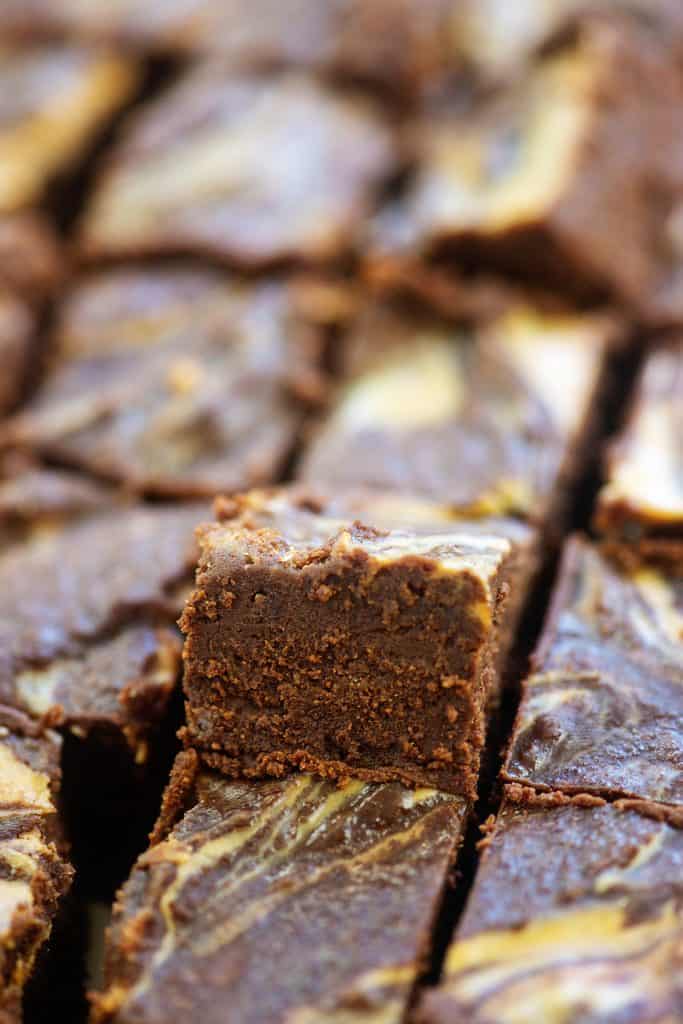 batch of chocolate fudge cut into squares.