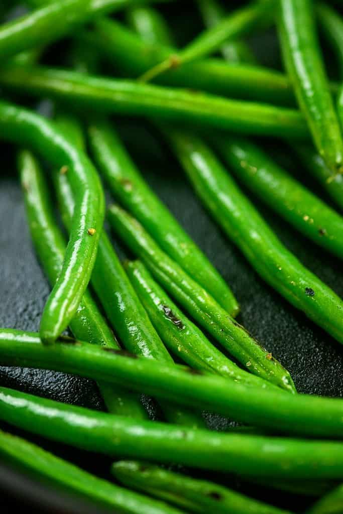 green beans in cast iron skillet.