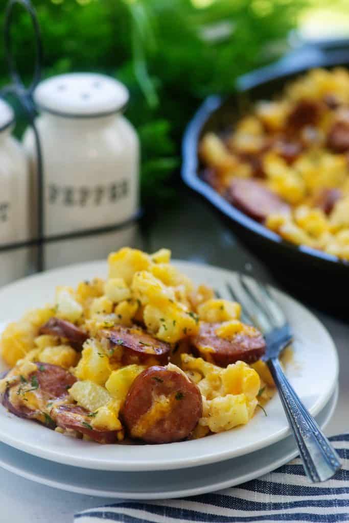 baked cauliflower mac and cheese on white plate.