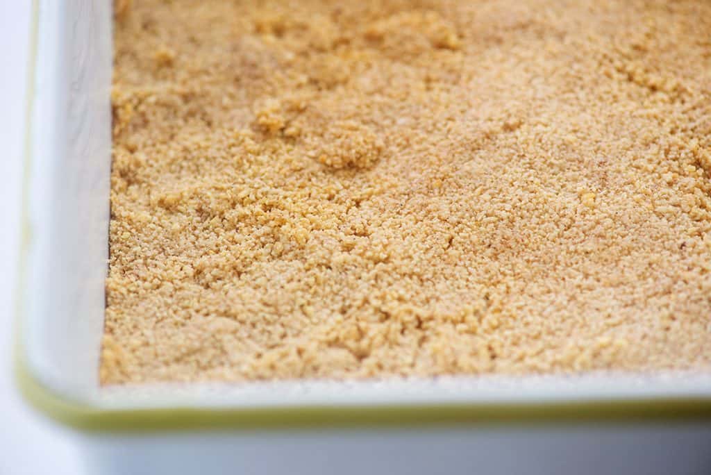 almond flour crust in white baking dish.