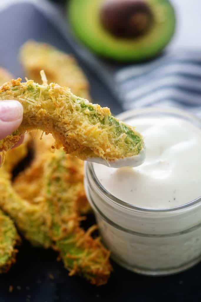 crispy avocado fry dipped in ranch dressing.