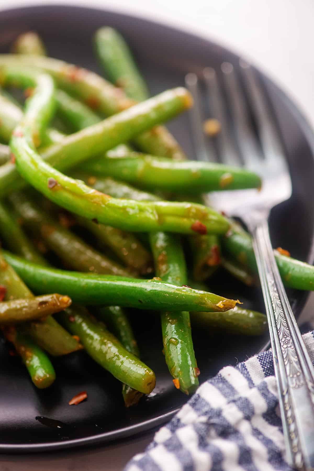 black plate full of keto Asian green beans.