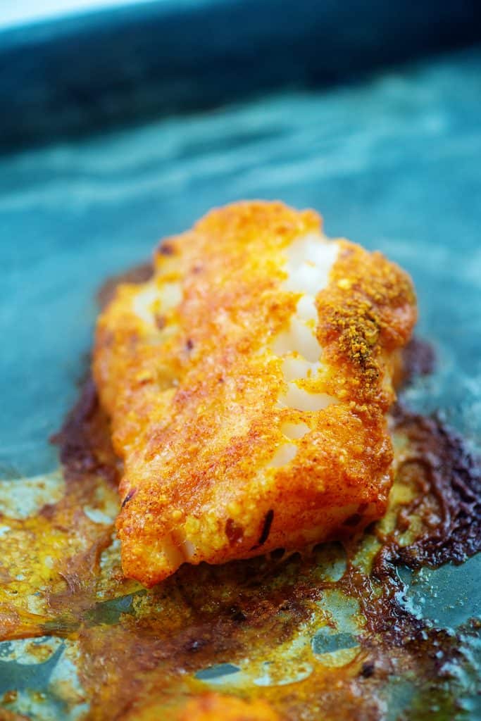 baked cod on baking sheet.