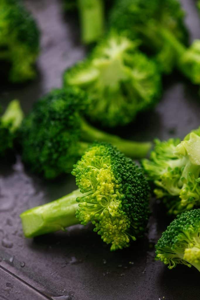 broccoli florets on sheet pan.