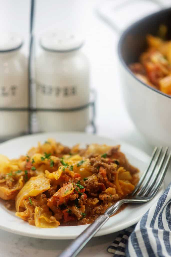 cabbage casserole on white plate.