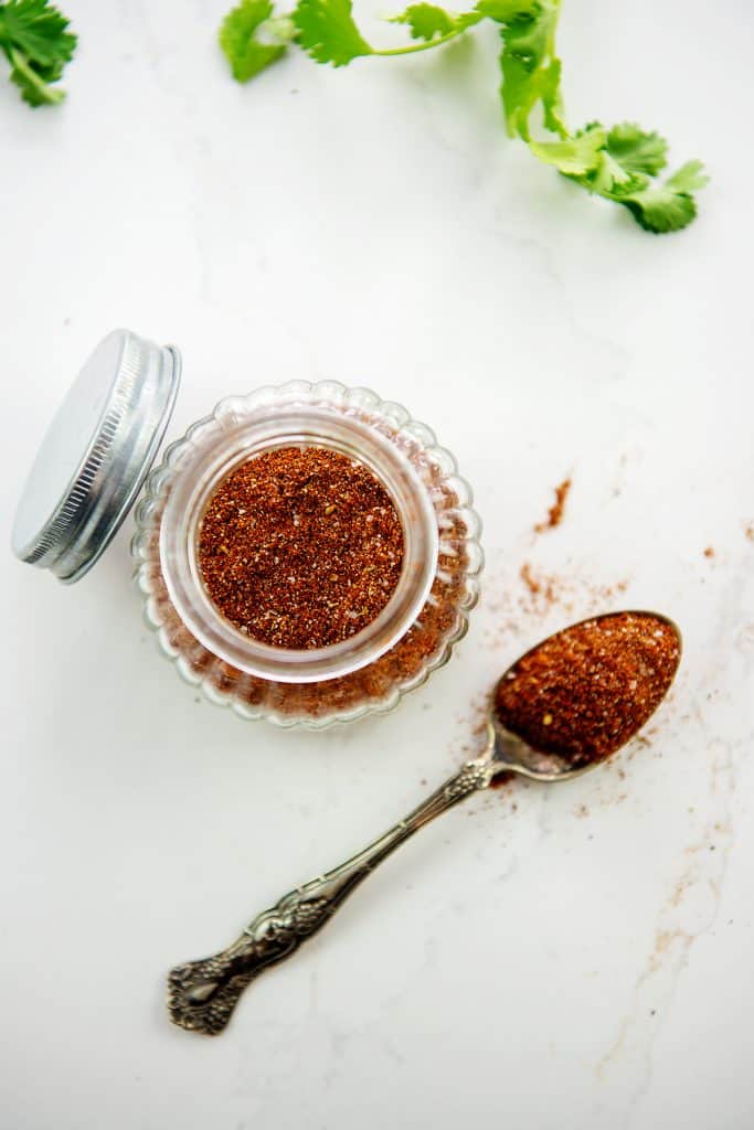 overhead view of keto taco seasoning recipe in glass jar.