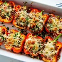stuffed peppers in white dish after baking.
