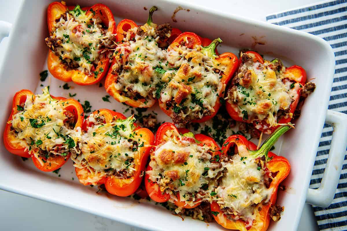 stuffed peppers in white dish after baking.