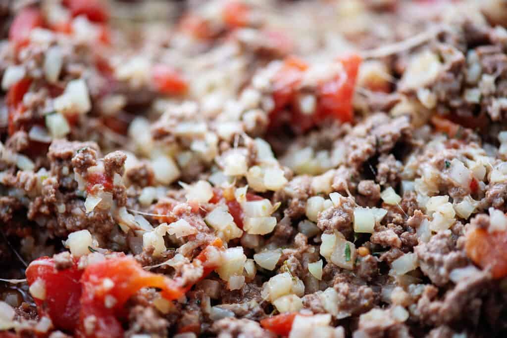 filling for Italian stuffed peppers made of cauliflower rice, beef, and Italian flavors.