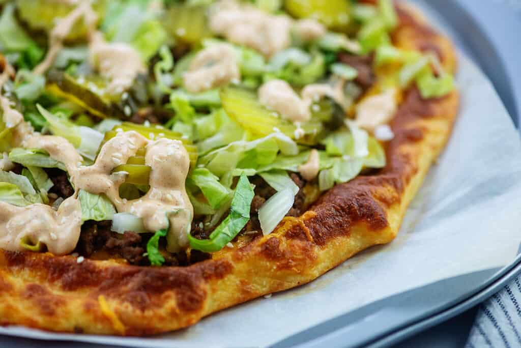 low carb pizza crust topped with beef, lettuce, pickles, and big mac sauce.