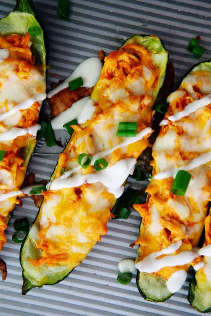 buffalo chicken zucchini boats on sheet pan.