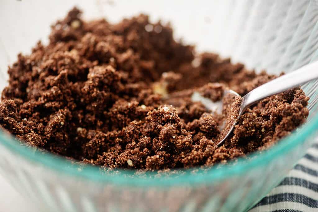 chocolate crust for cheesecakes in glass bowl.