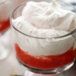 close up view of mousse with strawberry sauce.