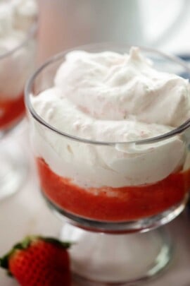 close up view of mousse with strawberry sauce.