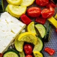 roasted vegetables with feta cheese on sheet pan.