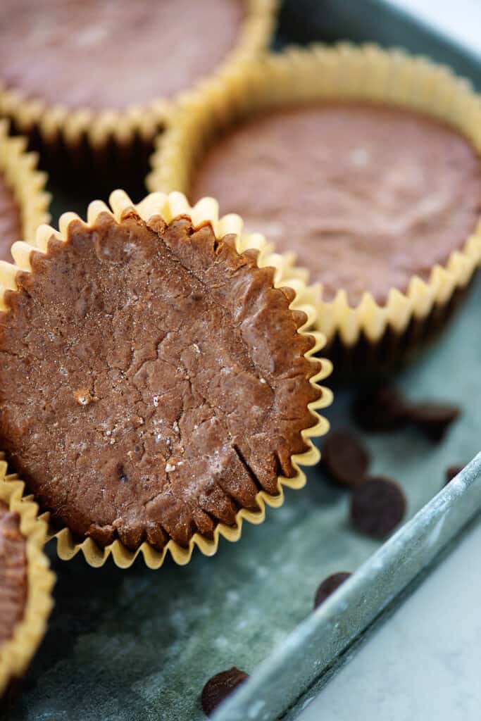 pile of mini keto cheesecakes in tray.