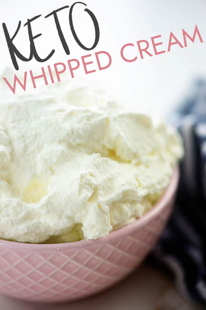 low carb whipped cream piled in pink bowl.