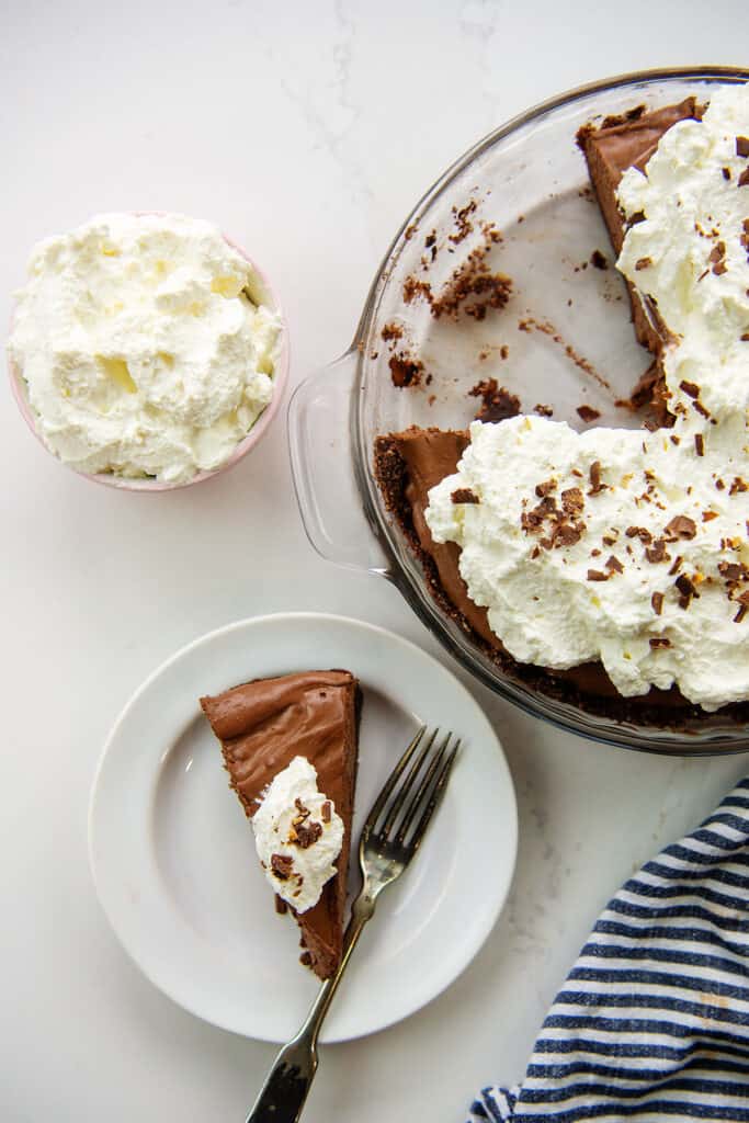 keto chocolate pie topped with whipped cream.