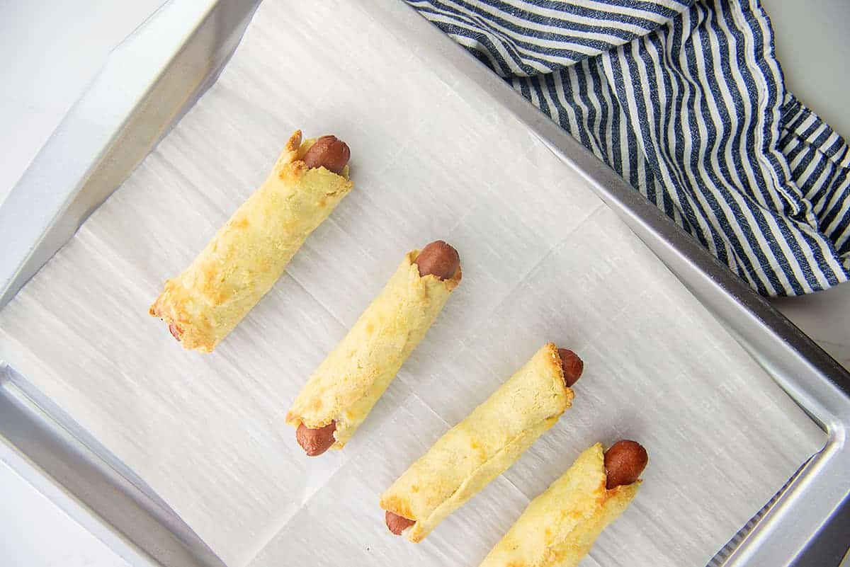 baked pigs in a blanket on baking sheet.