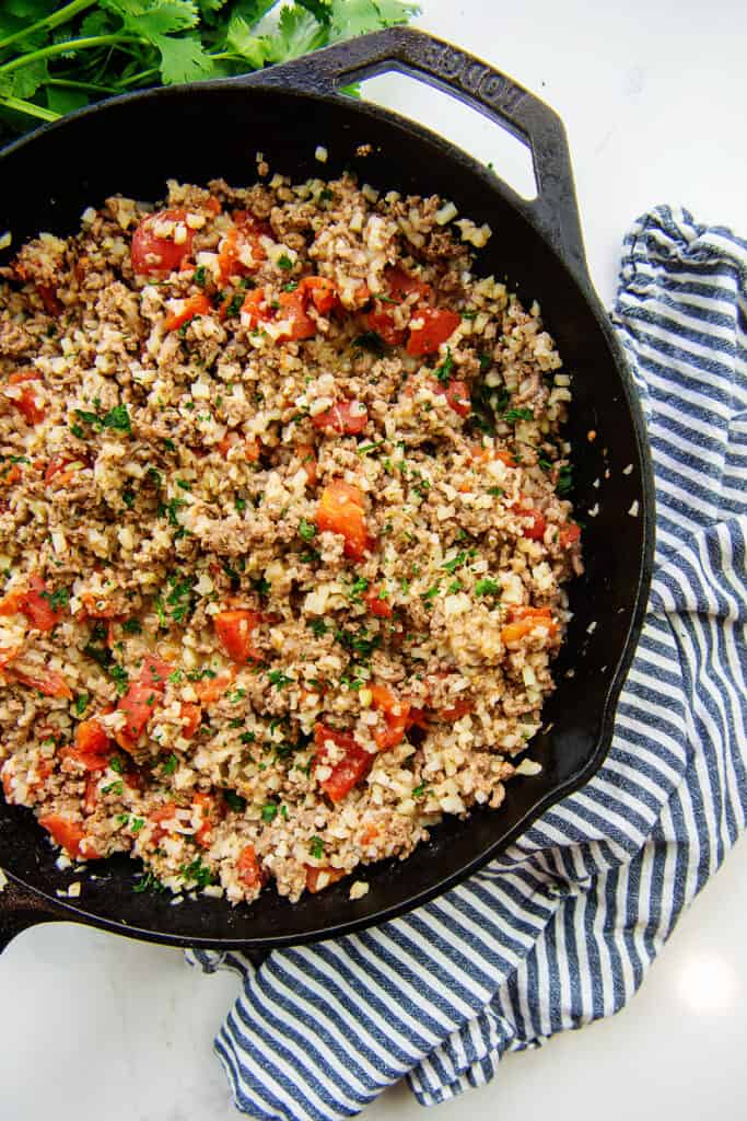 overhead view of low carb skillet meat in cast iron skillet.