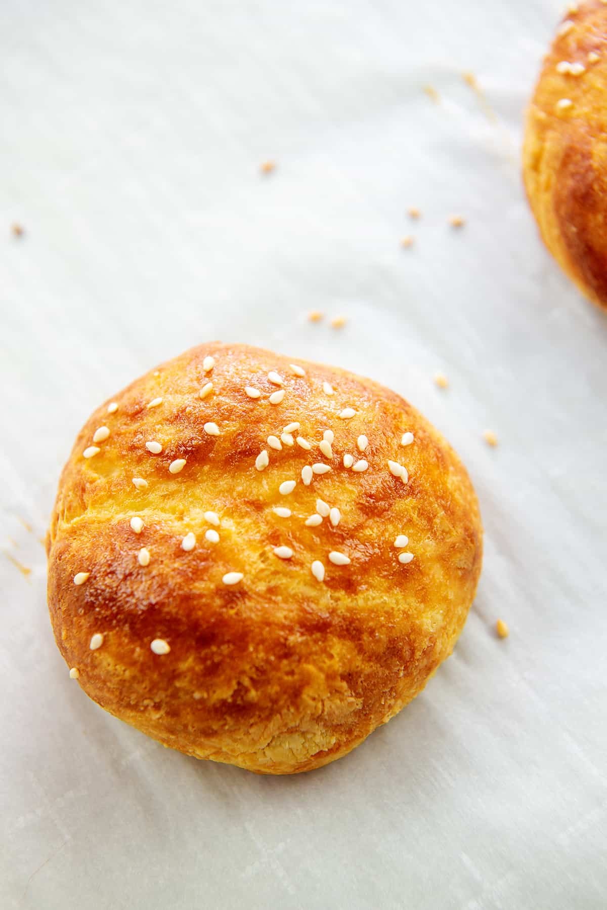 baked hamburger bun on parchment papper.