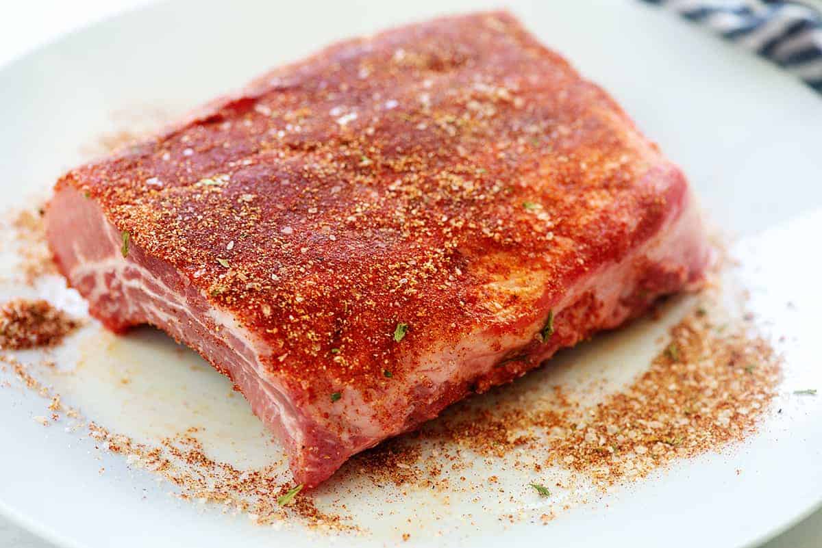 seasoned ribs on white plate.