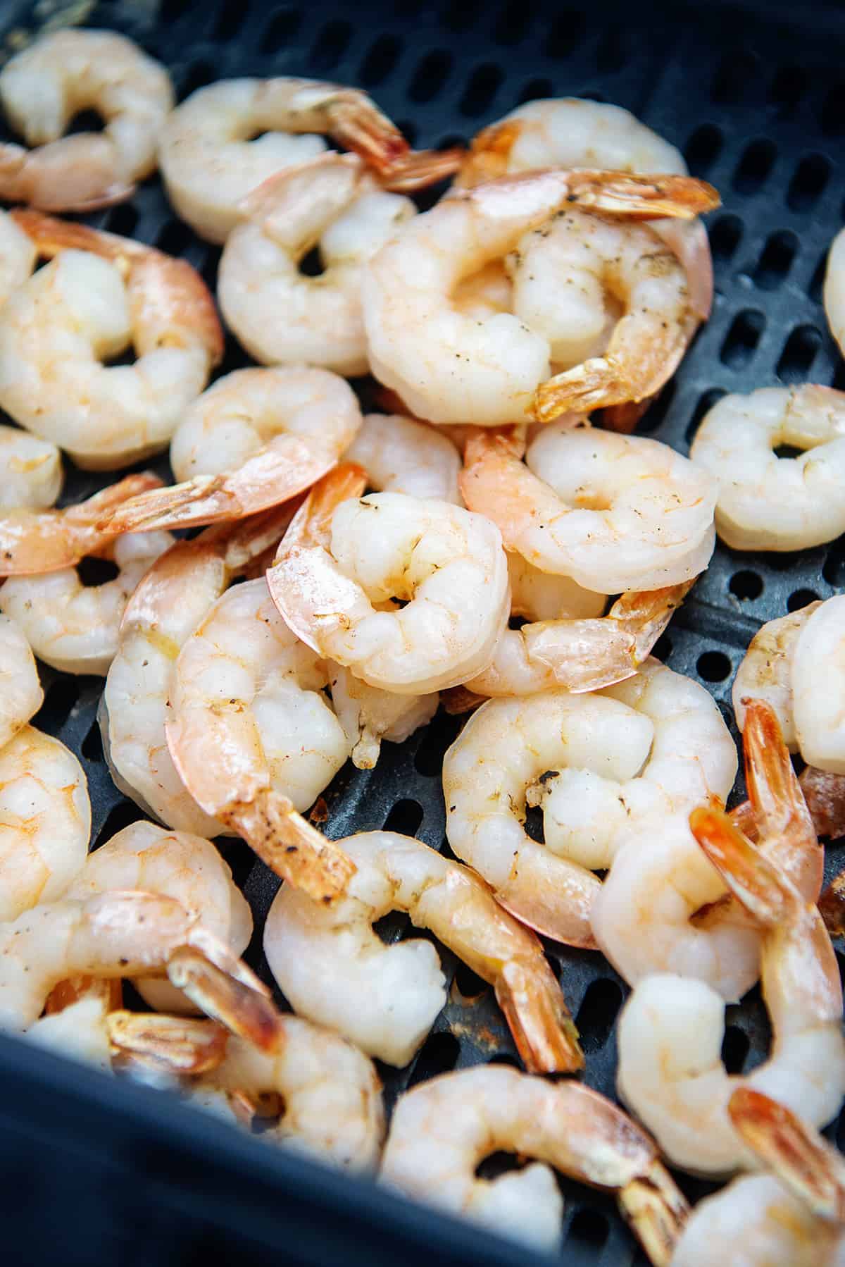 shrimp in air fryer basket.