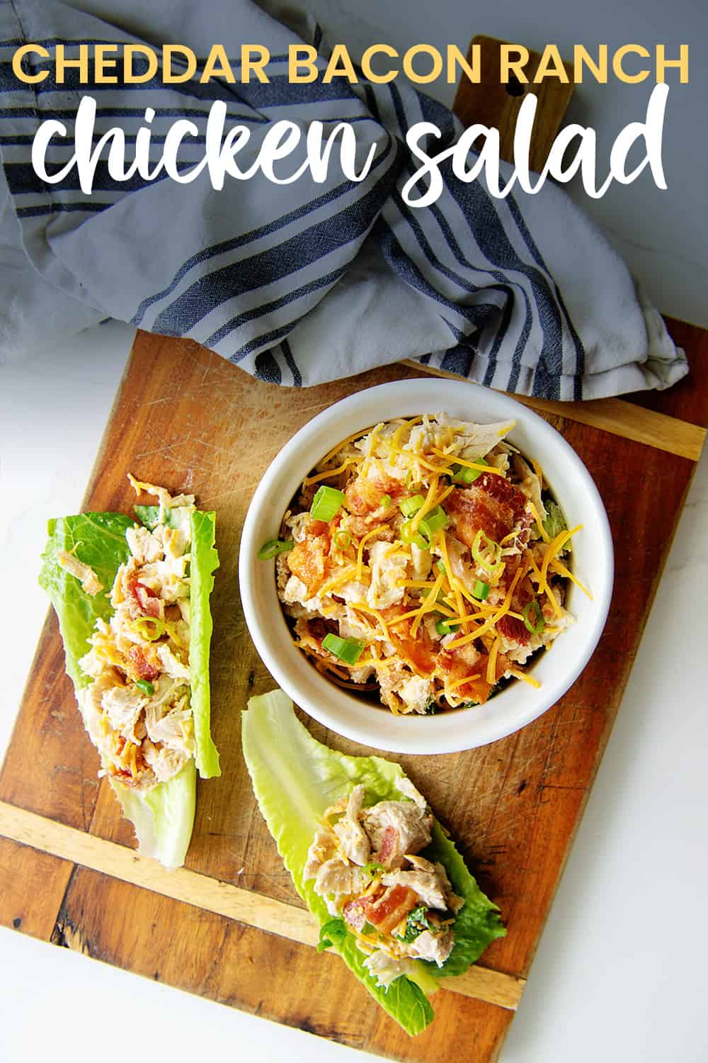 overhead view of chicken salad on cutting board with text for pinterest.