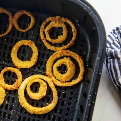 keto onion rings in air fryer basket.