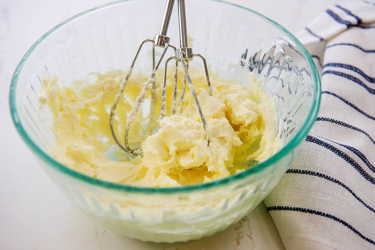 keto cream cheese frosting in glass mixing bowl.