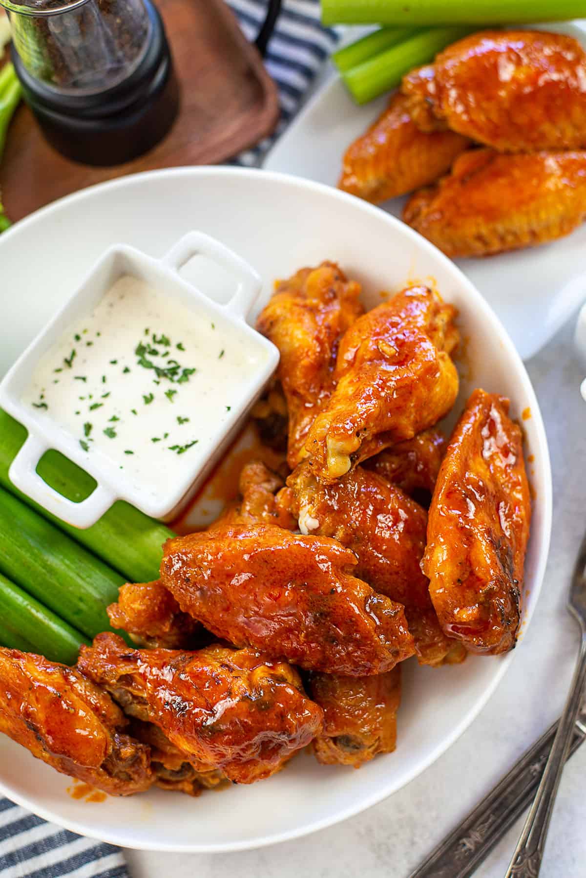 buffalo chicken wings in white bowl.