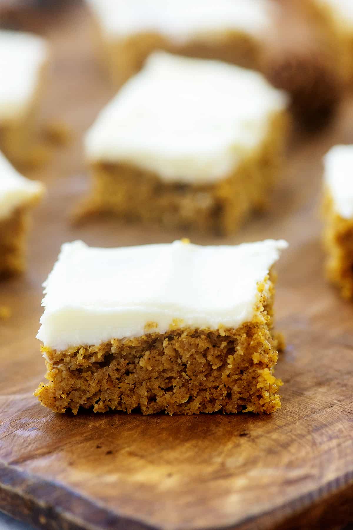 keto pumpkin bars on wooden board.