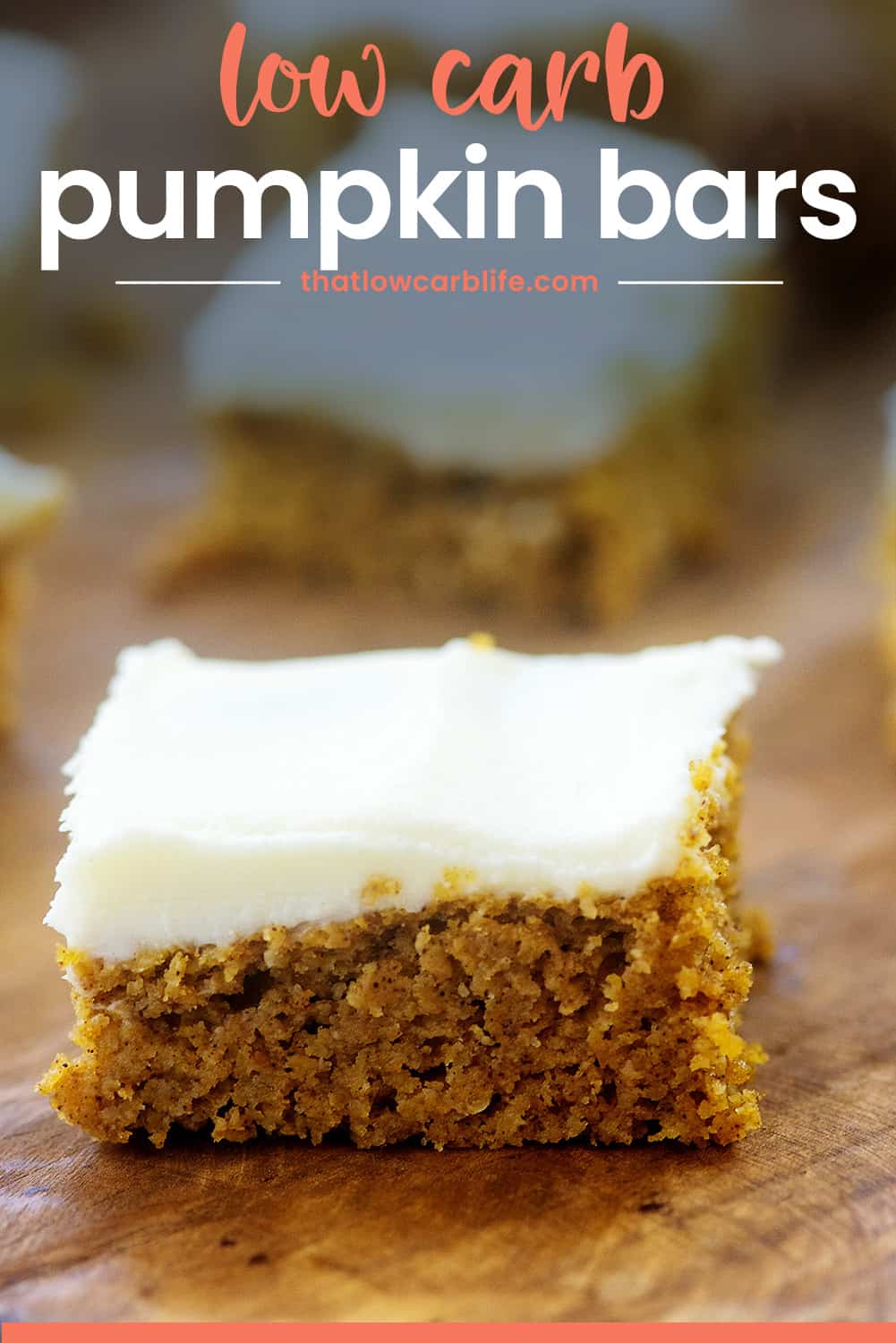 keto pumpkin bar on wooden cutting board with text for Pinterest.