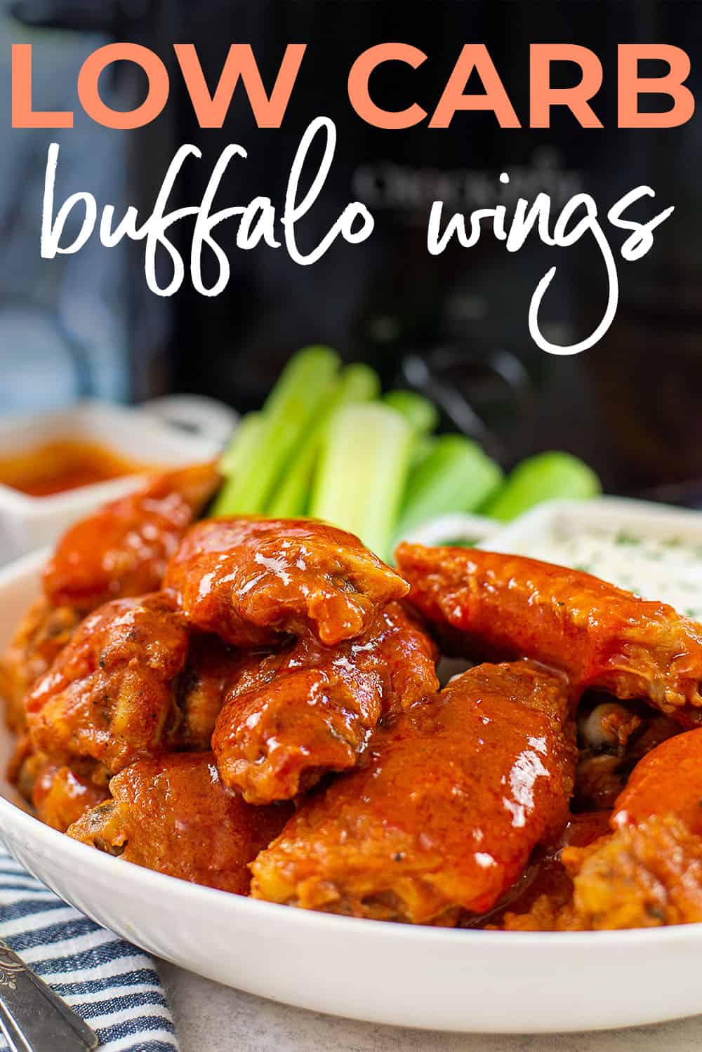 slow cooker wings in white dish.