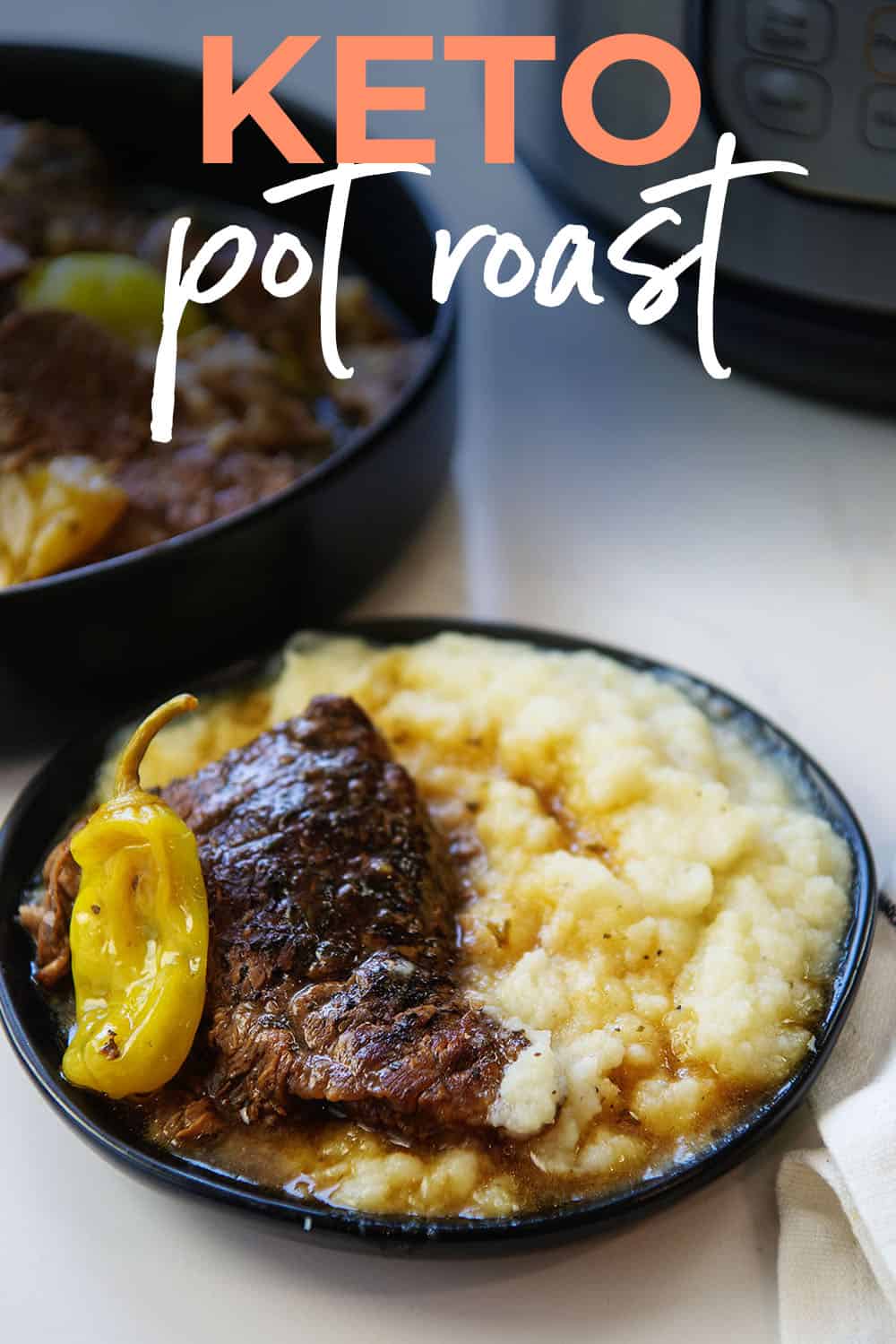 keto Mississippi Pot Roast on black plate with cauliflower mash.