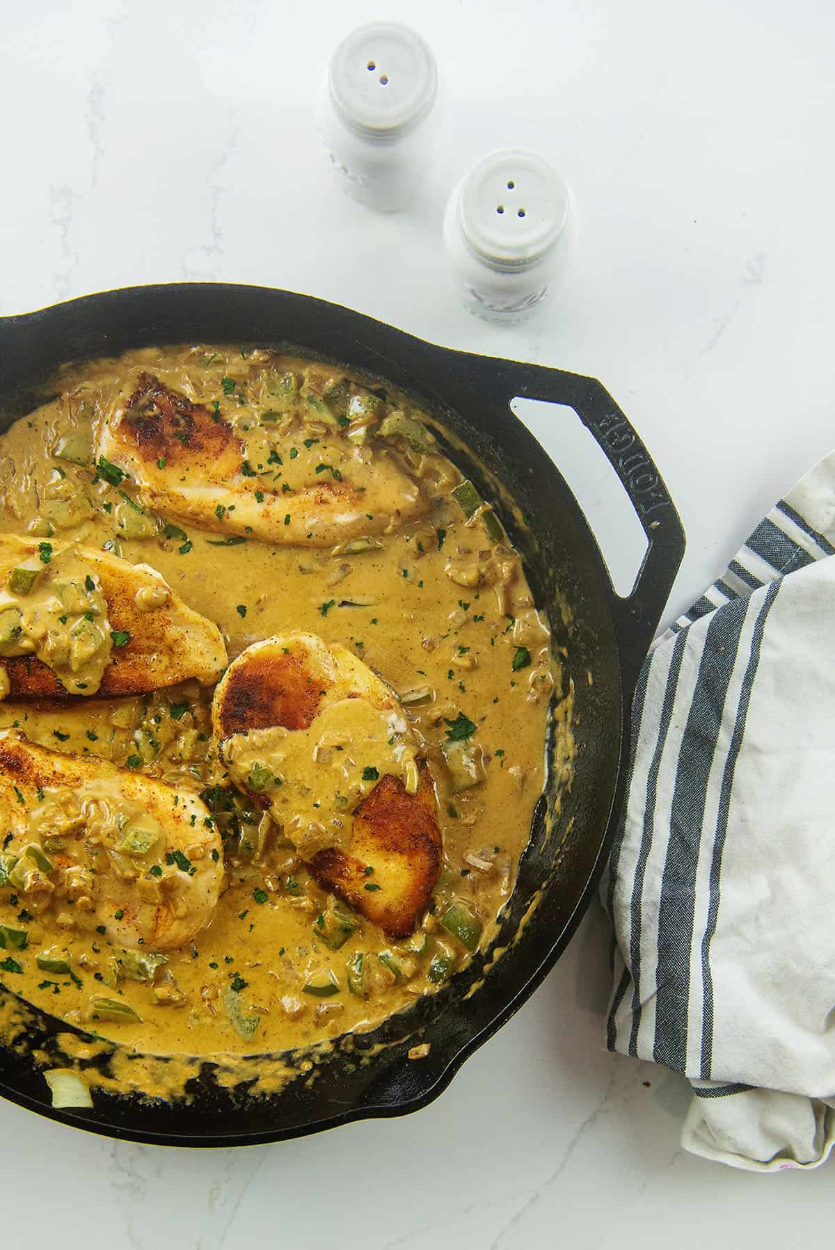 skillet full of Cajun chicken.