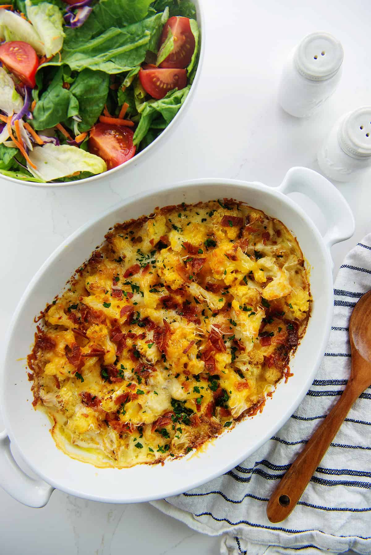 overhead view of cauliflower au gratin in baking dish.