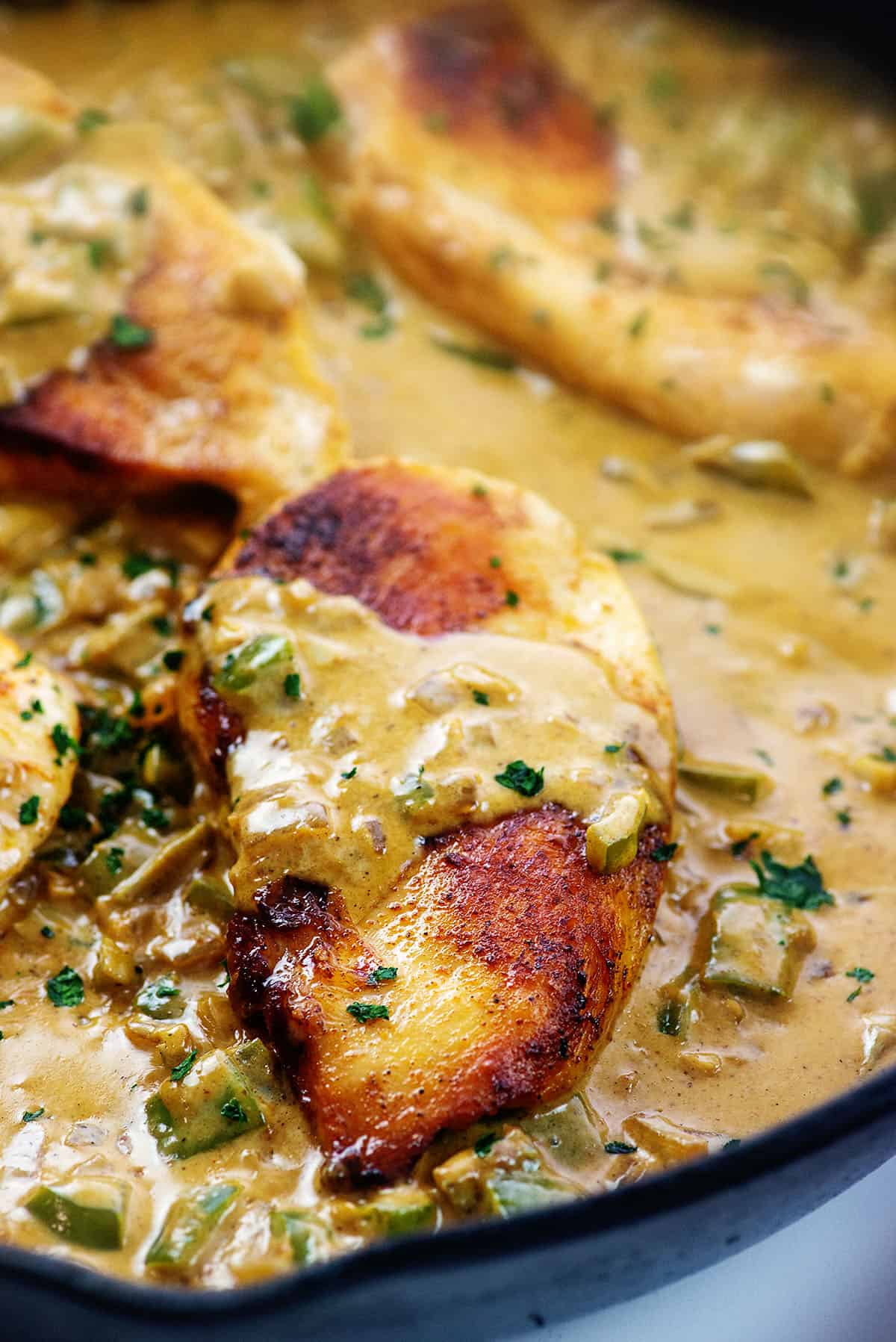 Cajun chicken in skillet.