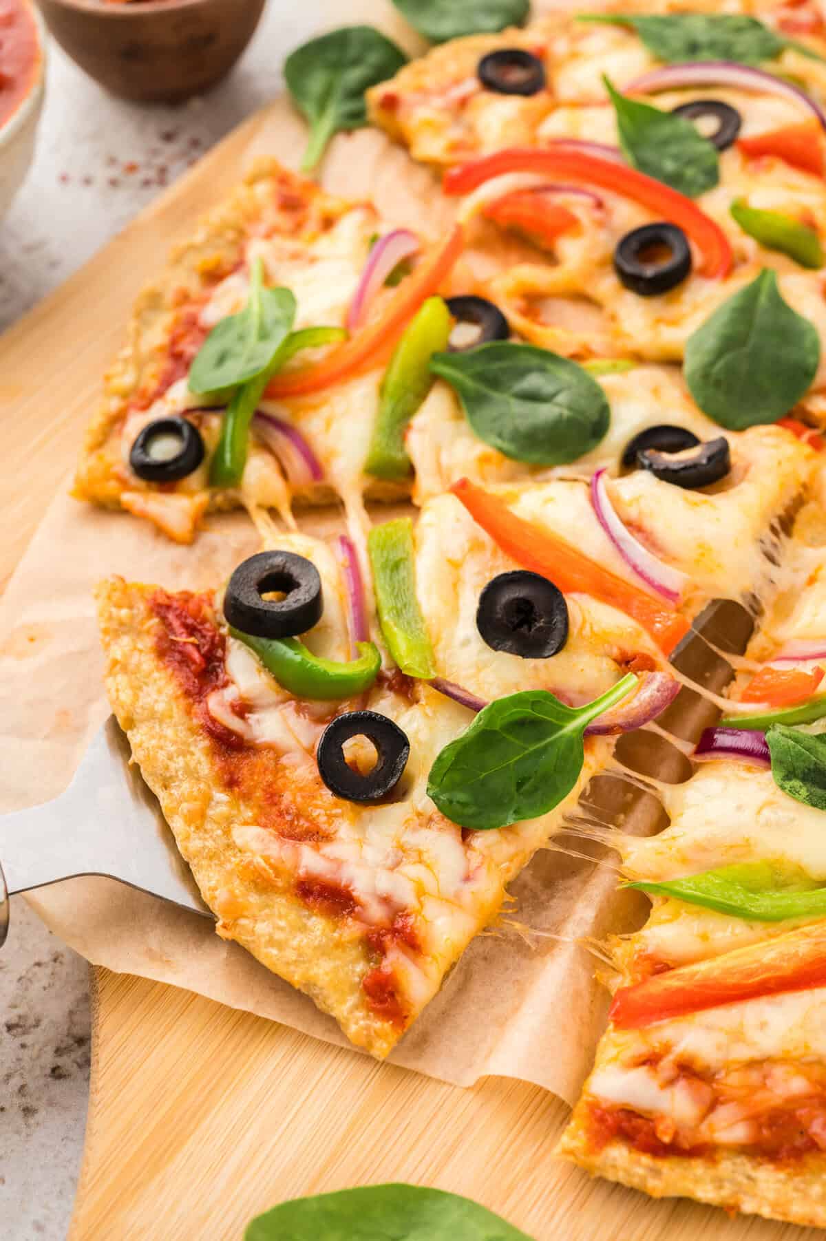 Chicken crust pizza on pizza server.