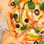 Slice of protein pizza made with chicken crust recipe.