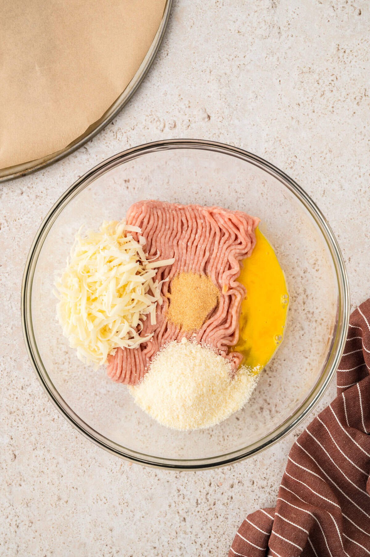 Ingredients for chicken crust pizza in bowl.