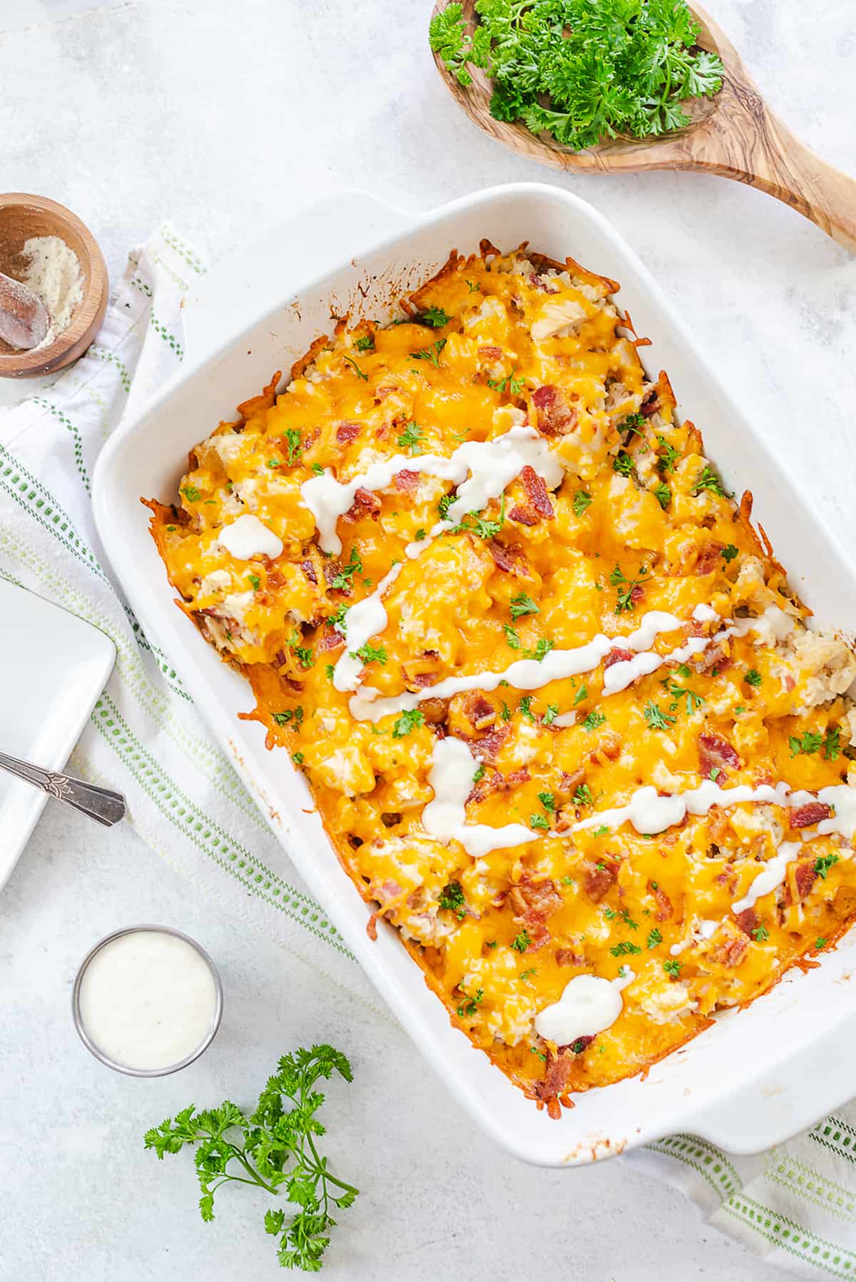 keto chicken bacon ranch casserole in white baking dish.