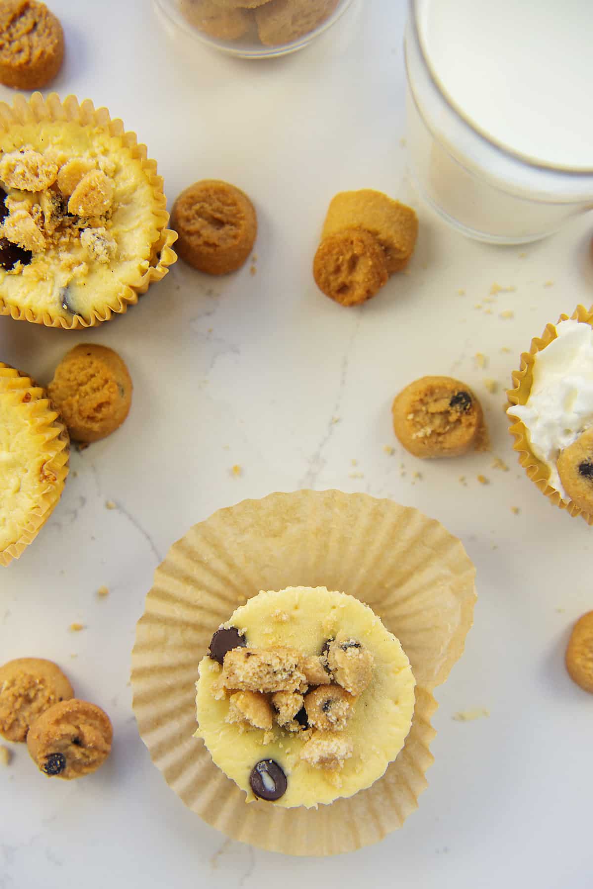 keto cookie dough cheesecakes on white counter.