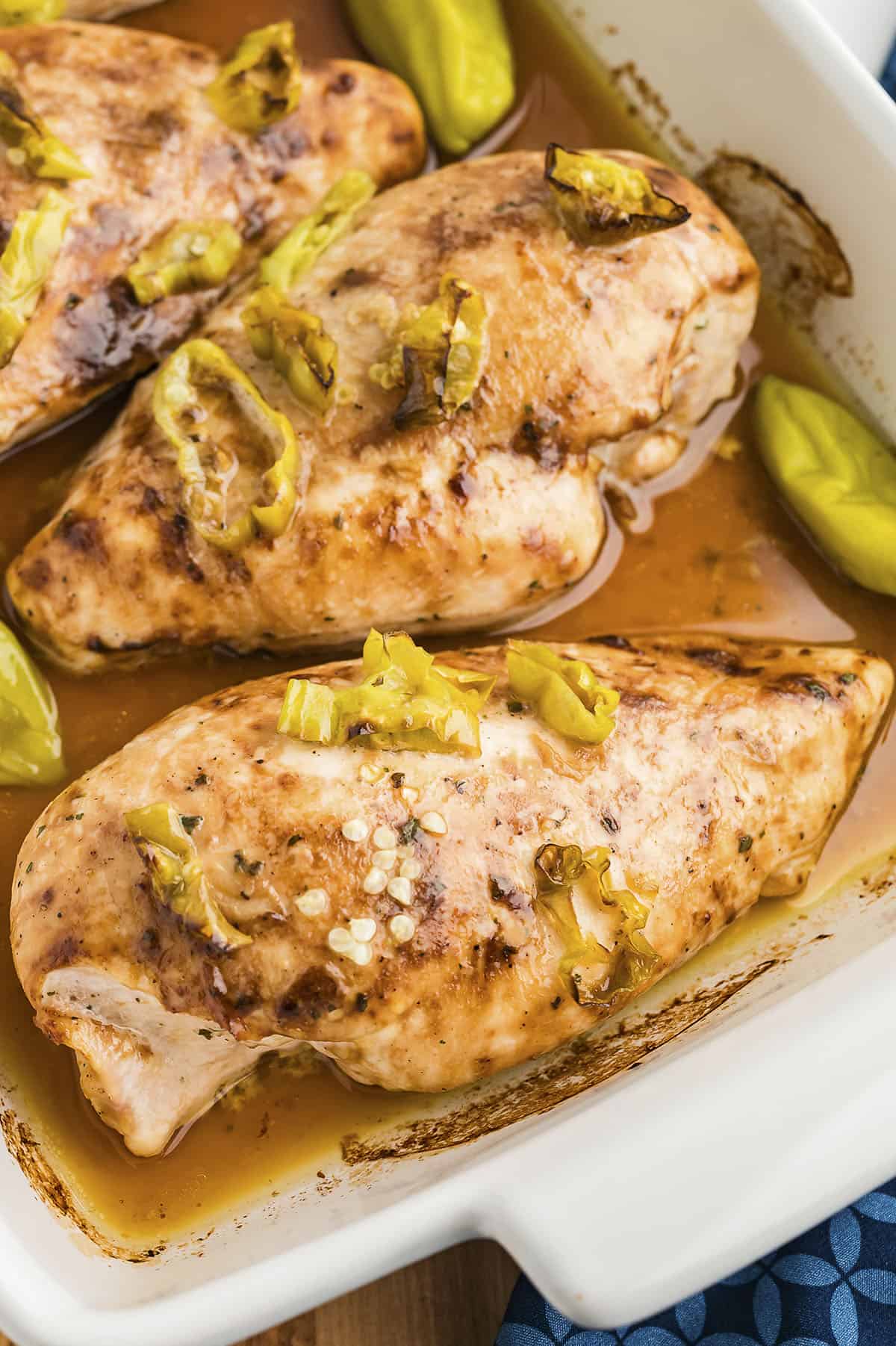 baked mississippi chicken in white dish.